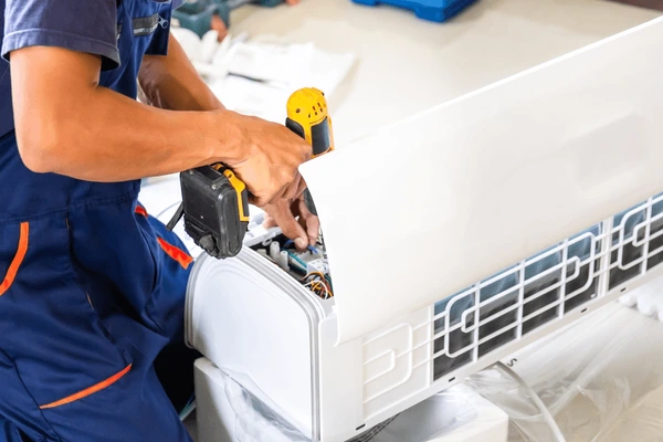 air-conditioning-technicians-install-new-600nw-2411194887
